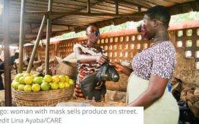 Togo woman with mask sells produce on street, credit Lina AyabaCARE